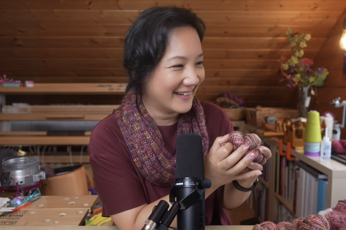 Felicia Lo holding her handspun yarn on Taking Back Friday Live