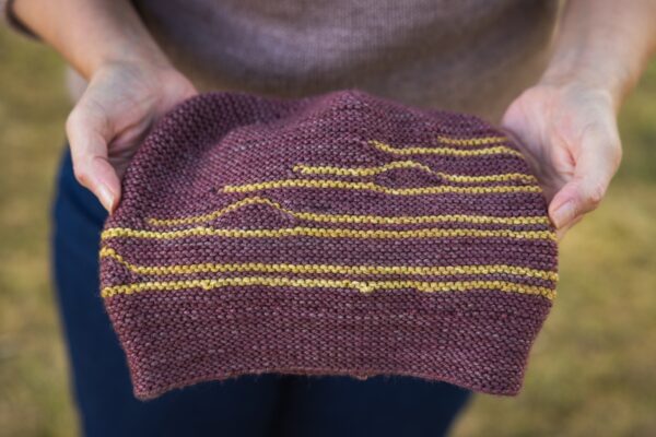 Construction of a striped, knit flat hat