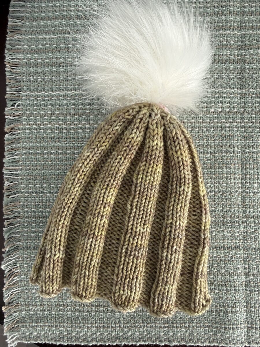 Machine-knit hat.