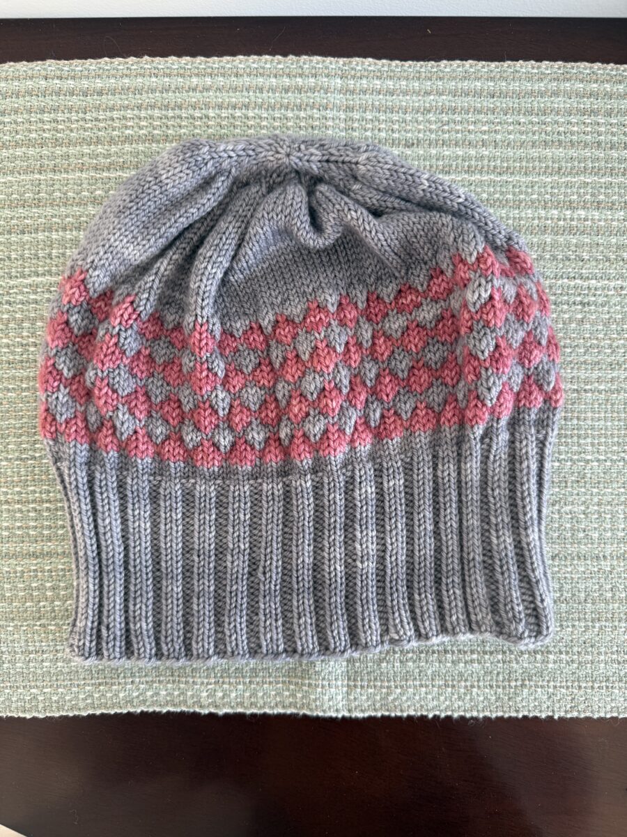 Machine-knit hat.