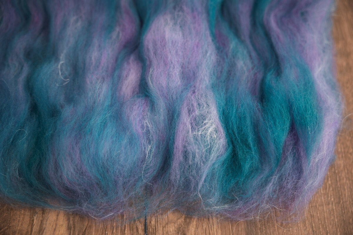 Corriedale Tanzanite + BFL Silk Snowing in Tremblant + Nettle Prepared on a blending board