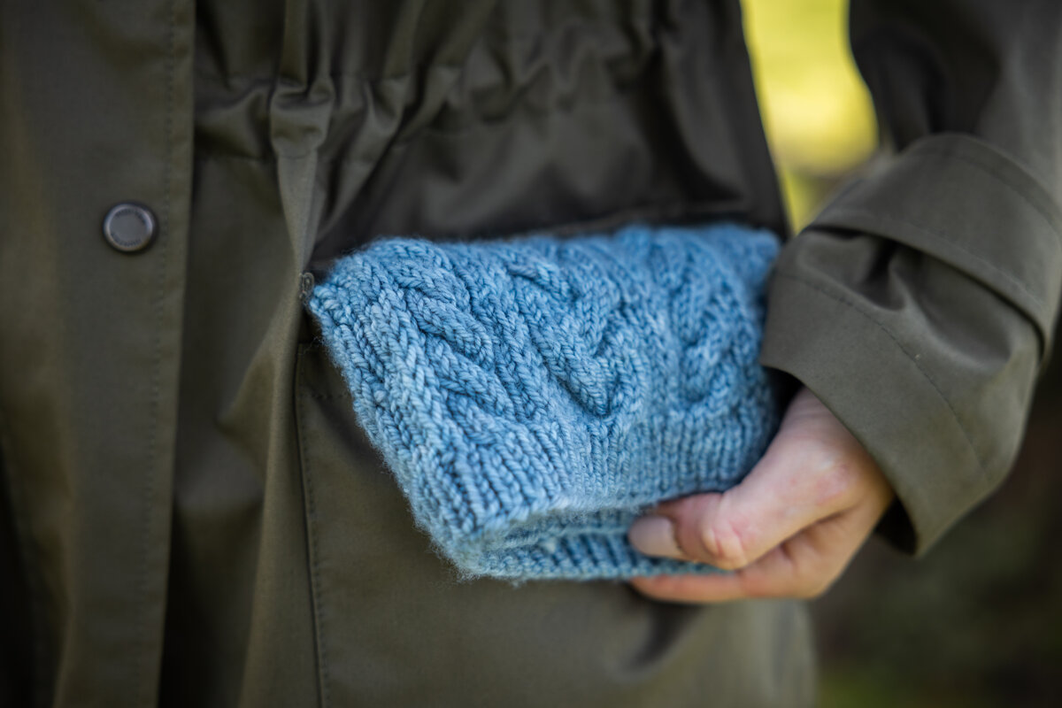 Cowl in her pocket 