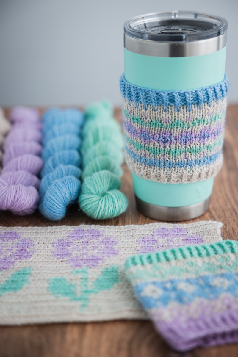 Knit mug cozy using Secret Stash Club yarn mini-skeins