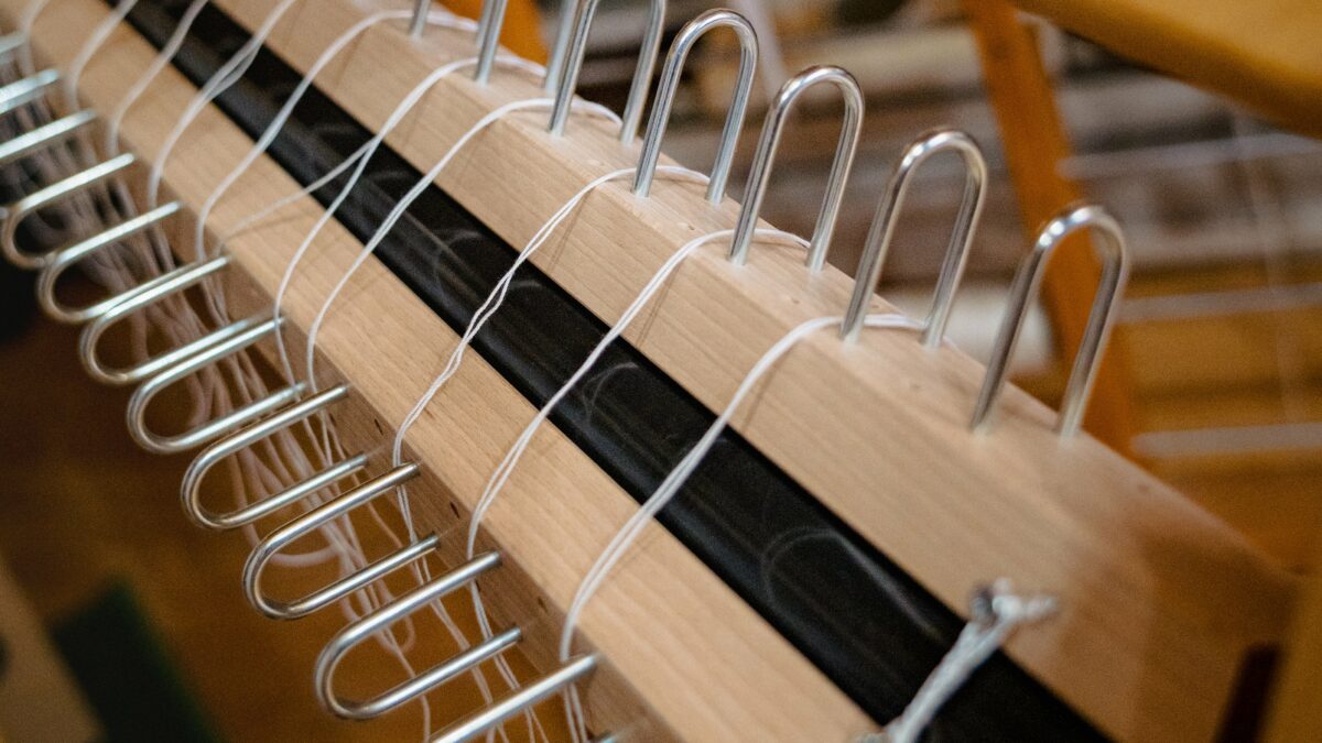 Rakes installed on sectional warp beam to create 4 cm sections.