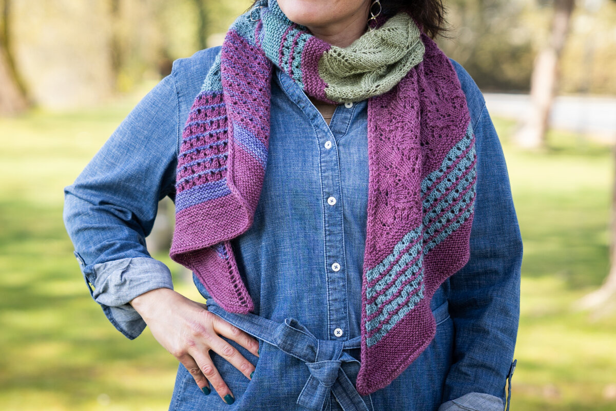 Design by Charlotte Lee
Knit in Trifecta Fine Black Raspberry (MC) and Lavender, Mermaid, Blue Canoe, Clearwater, and Sage (CC)

Summer Spectra KAL 2026 Pattern