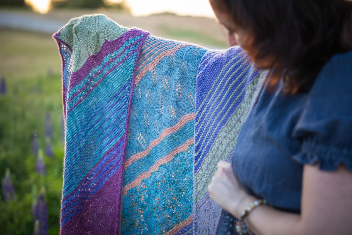 knit shawl with garter ridges and lace sections