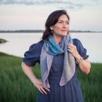 knit shawl with garter ridges and lace sections