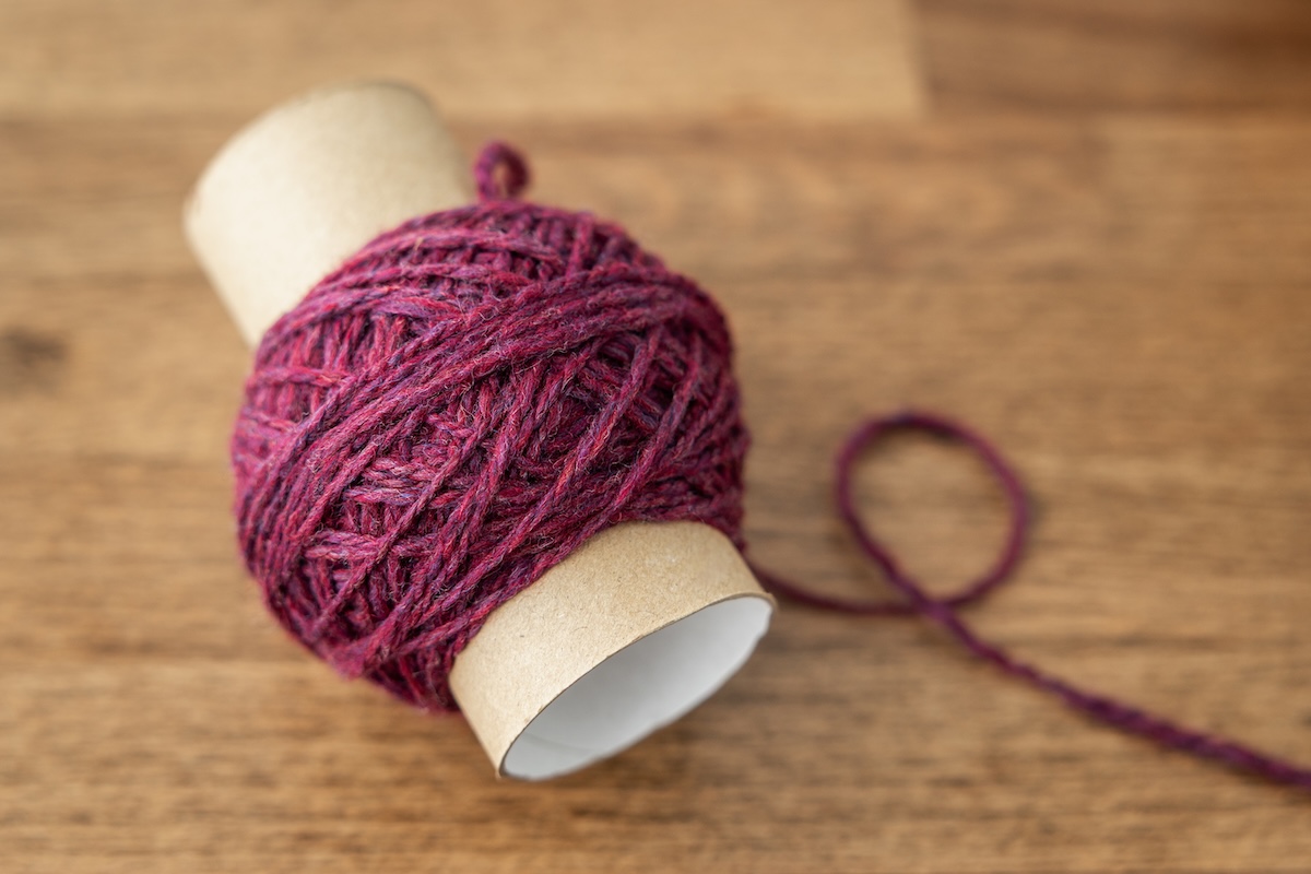 Toilet paper roll with handspun singles