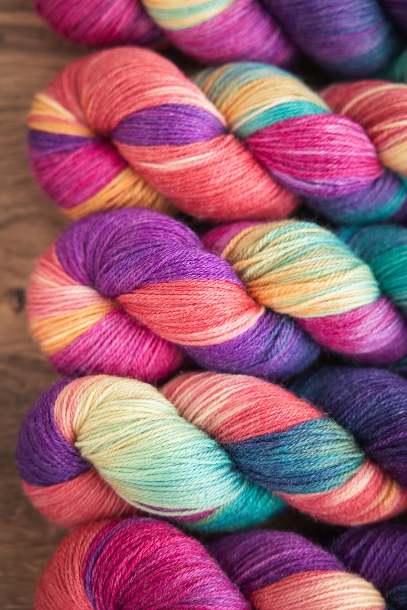 Colourful hand-dyed yarn skeins by SweetGeorgia on a bamboo and wool blend yarn