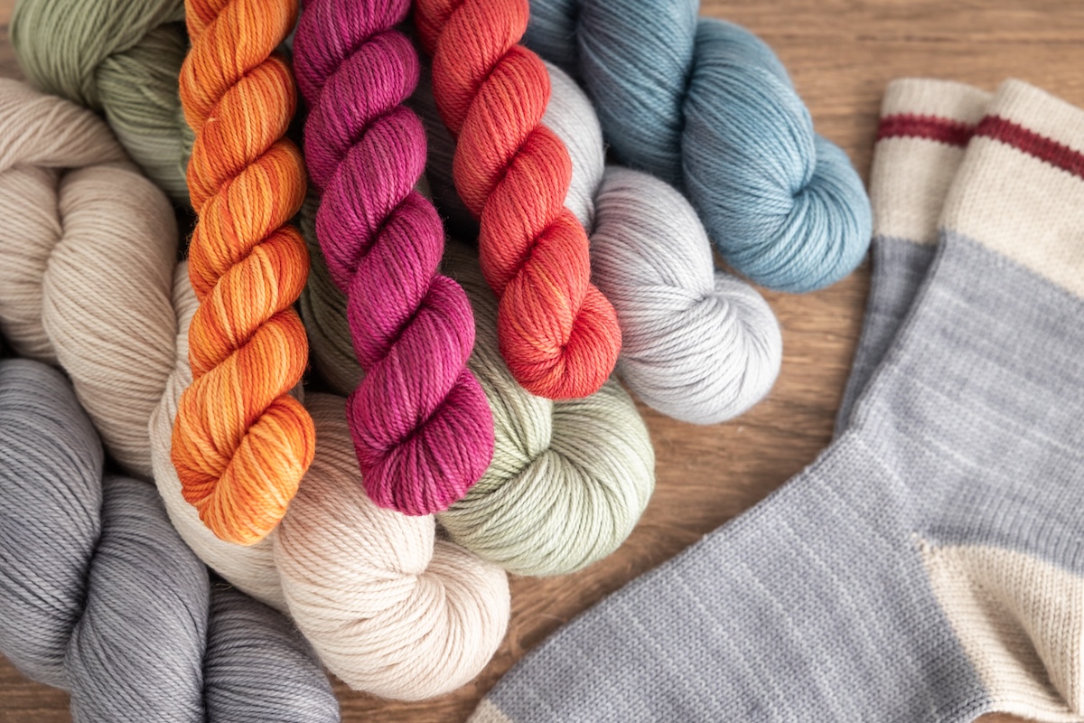 Hand dyed sock yarns used in knitting the Classic Cabin Socks CSM pattern